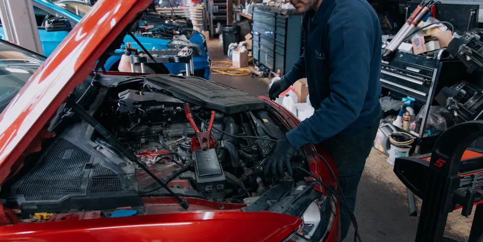 Wheels VT technician working under a bonnet